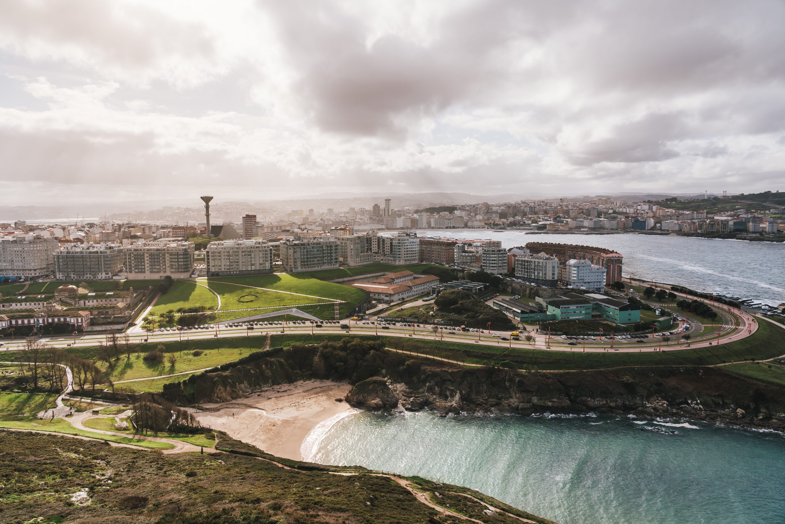Aerial view of A Coruna cityscape from the tower of hercules with coastline and beach